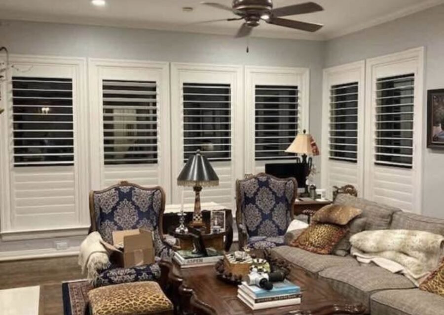 Custom hardwood plantation shutters in a traditionally furnished Dallas–Fort Worth living room