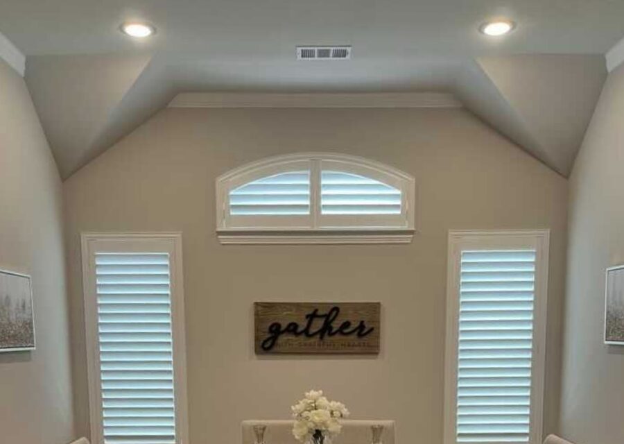 Custom arched hardwood shutters fitted to a specialty-shape window in a DFW home